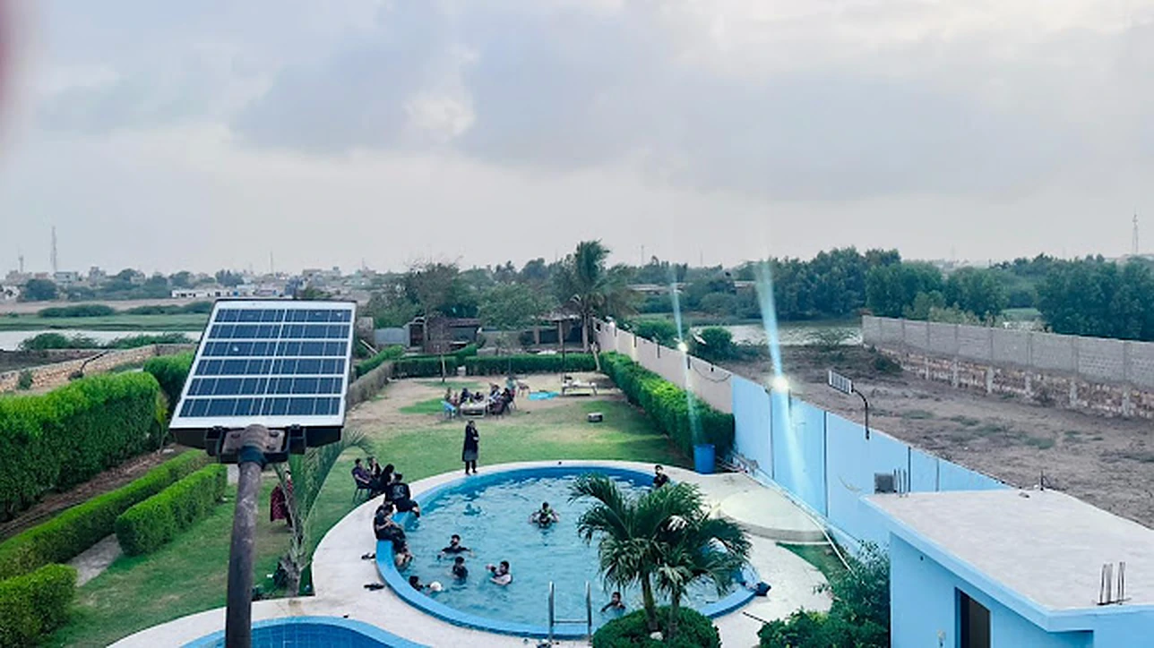 Guests enjoying the pool during the day