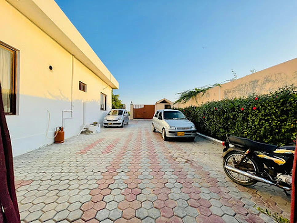 Paved private parking inside the compound