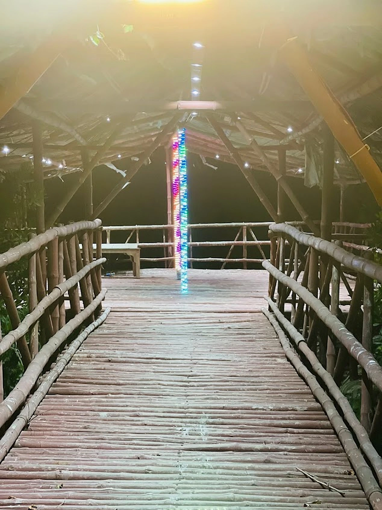 Bamboo walkway hut with lights at Agha Farmhouse